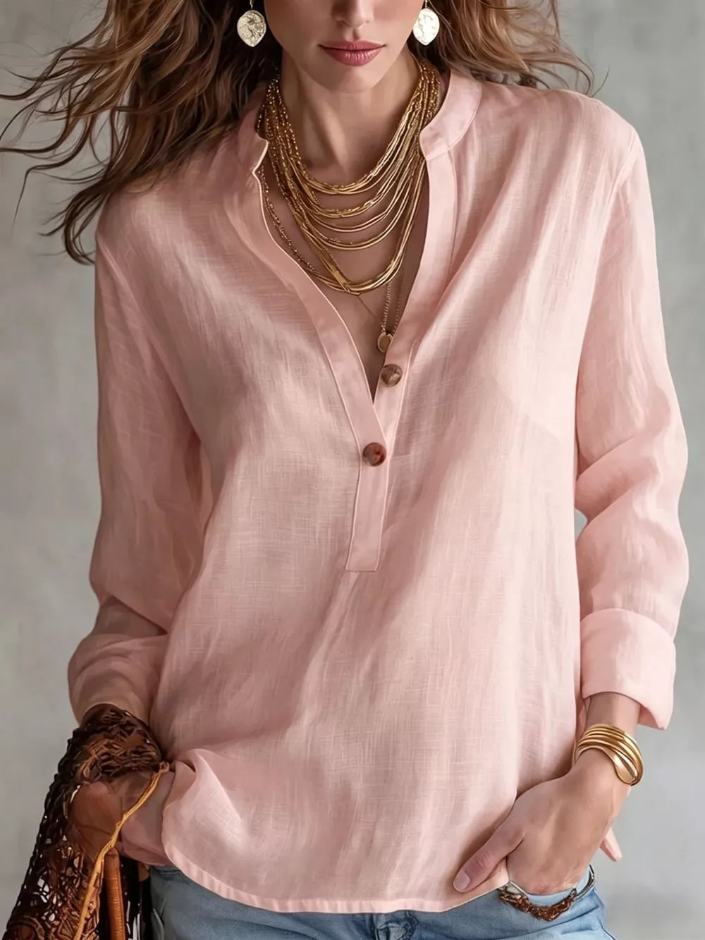 blouse in blush pink featuring buttoned and relaxed fit