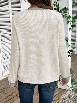 Ivory ribbed maternity shirt with gray contrast trim and cuffs.