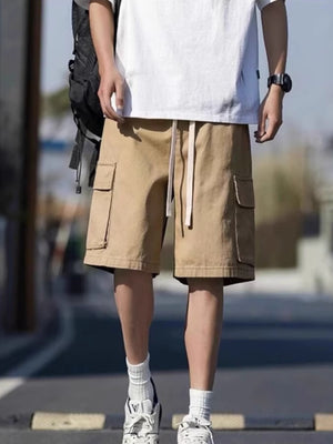Men's tan casual cargo shorts with drawstring waist and side pockets.