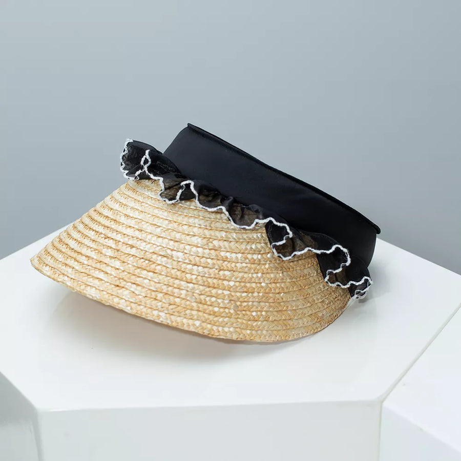 Straw visor hat with black band and white lace trim