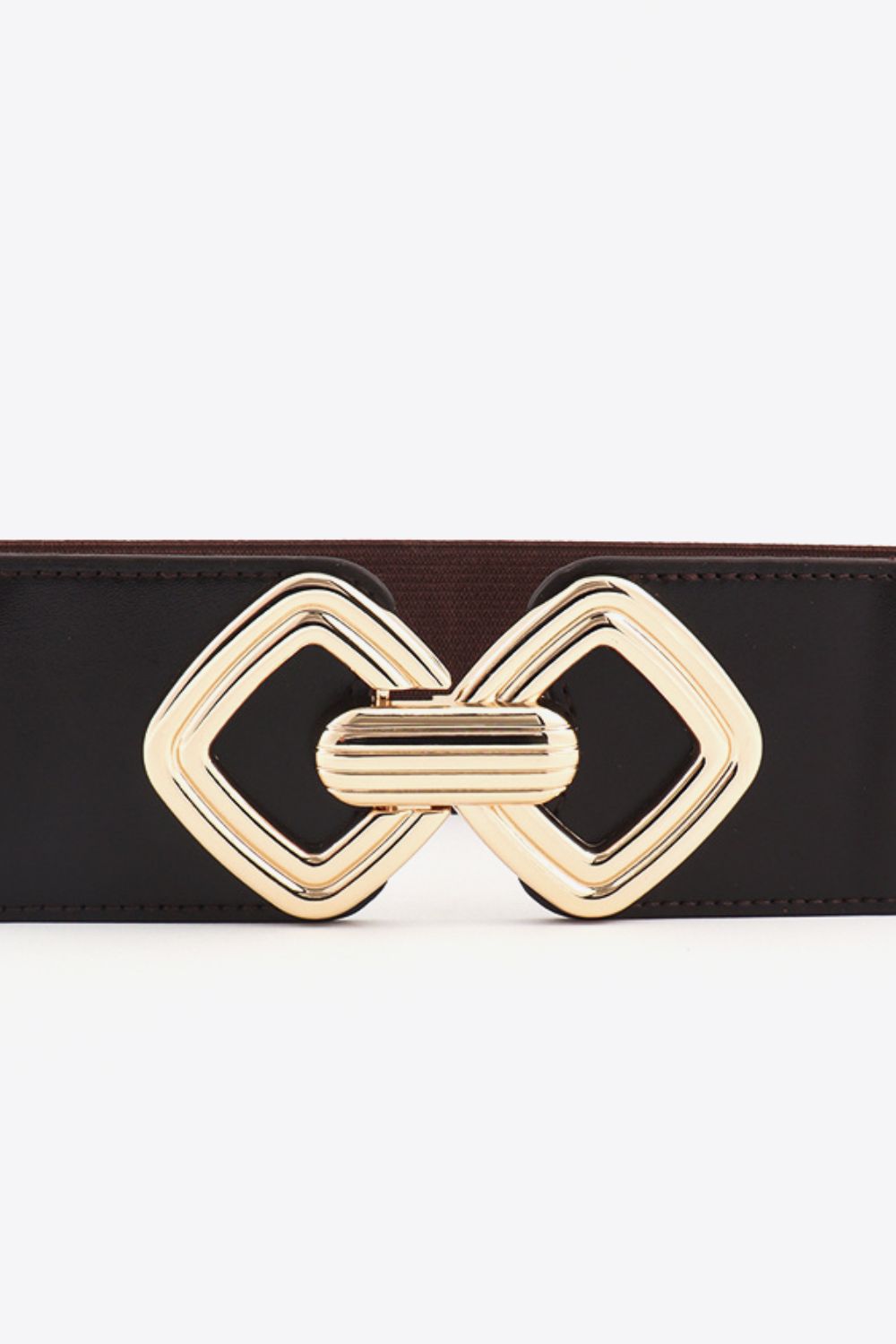 Black elasticated waist belt with a gold geometric buckle detail