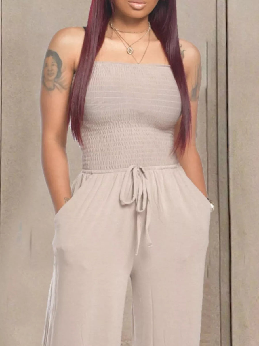 Strapless smocked taupe jumpsuit with wide legs and drawstring waist