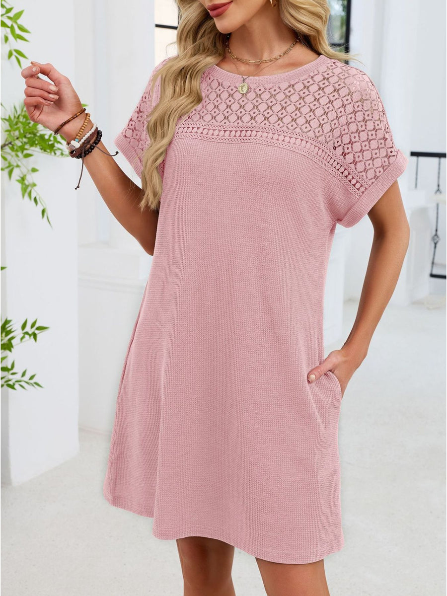 Blush pink t-shirt dress with short sleeves and sheer lace yoke detail.