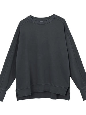 Dark gray oversized sweatshirt with raw-edge seams and crewneck.