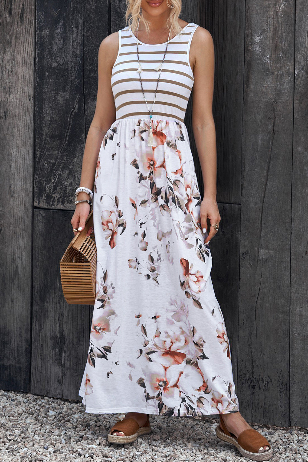 Striped bodice floral maxi dress with A-line cut and round neckline.