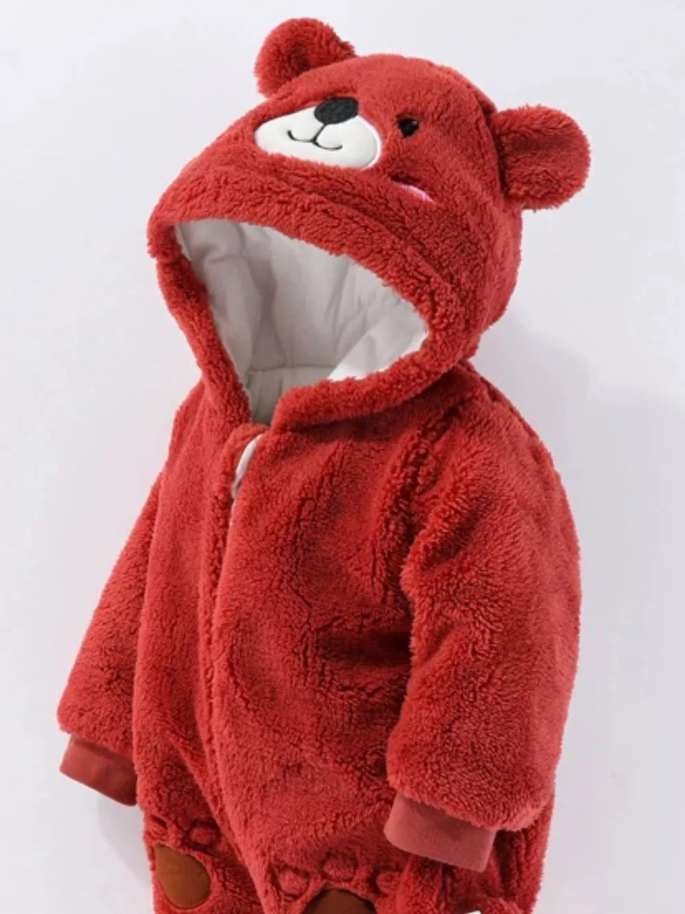 Red fleece baby bear hooded one-piece with embroidered face and ears.