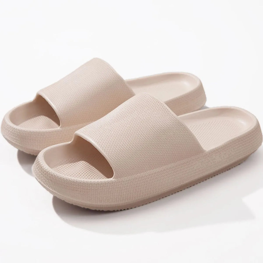 Textured cloud slides slippers in apricot with thick soles and a ribbed upper.