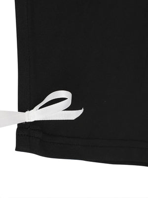 Black capri romper with white lace trim tie detail