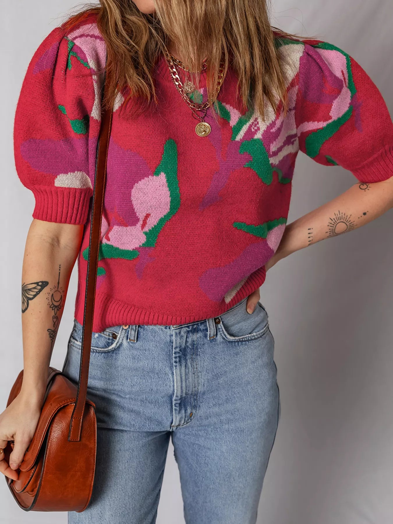 Scarlet abstract floral puff sleeve sweater with short sleeves and crew neck.
