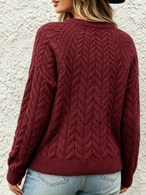 navy blue pullover sweater with decorative button and raglan sleeve