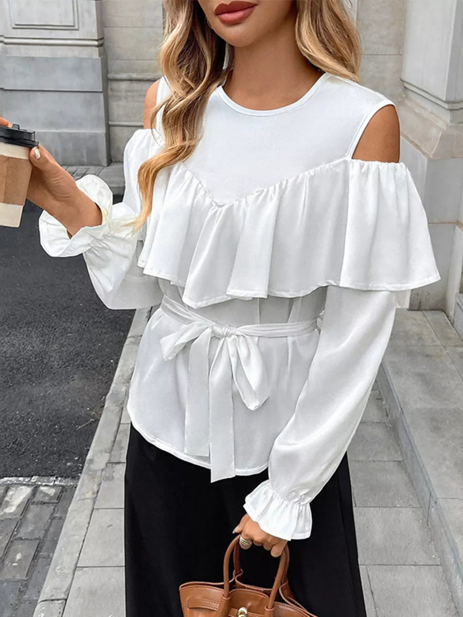 White ruffled cold shoulder maternity blouse with tie belt and bell sleeves.