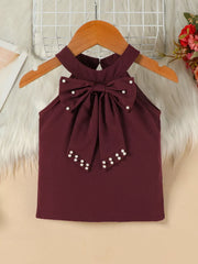 Burgundy toddler top with pearl bowknot detail and halter neck.