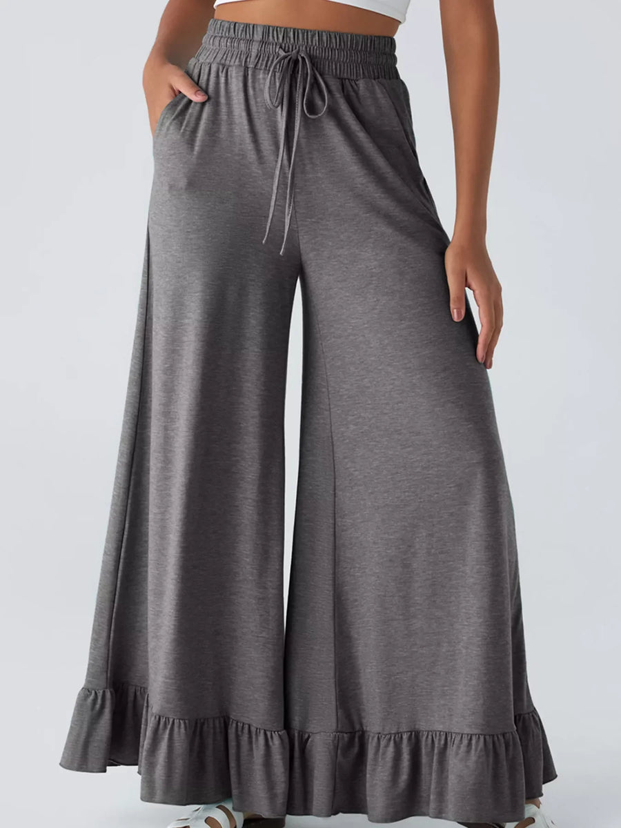Dark gray wide-leg pants with ruffled hem and drawstring waist