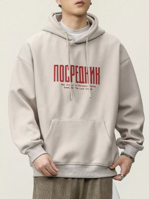 Light beige cotton hoodie with red graphic text and drawstring hood.