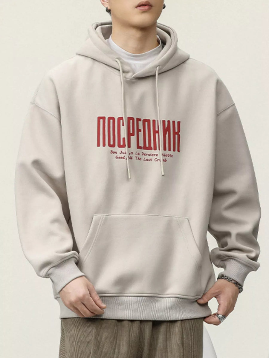 Light beige cotton hoodie with red graphic text and drawstring hood.