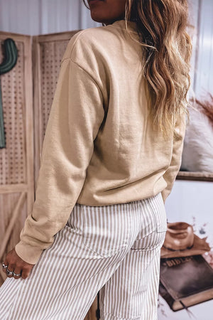 65% polyester, 35% cotton Care instructions: Machine wash cold sweatshirt in beige with relaxed silhouette