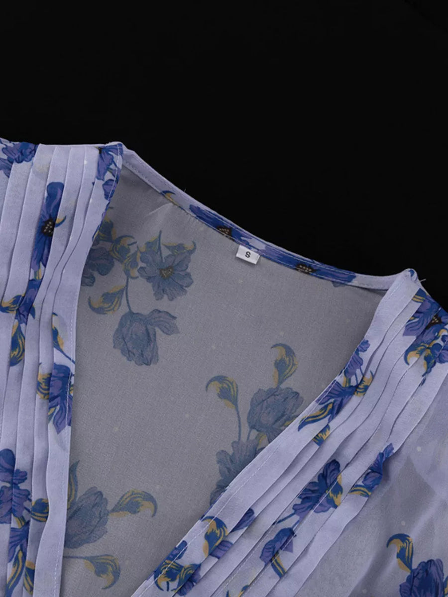 Sheer floral print dress with V-neck and pleated detail
