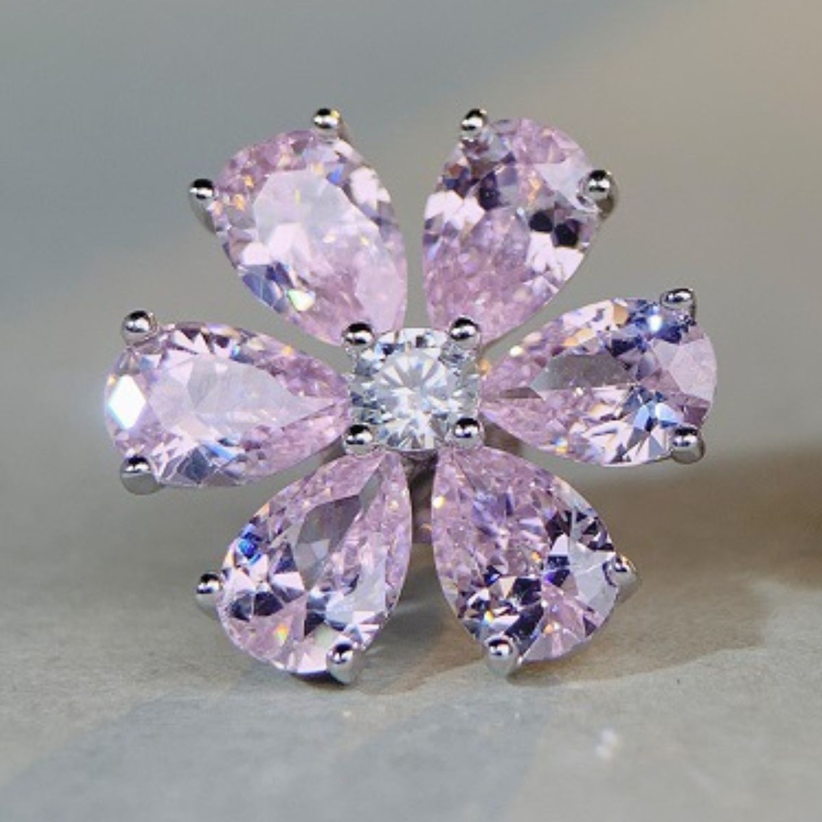 silver earrings featuring zircon stones and floral