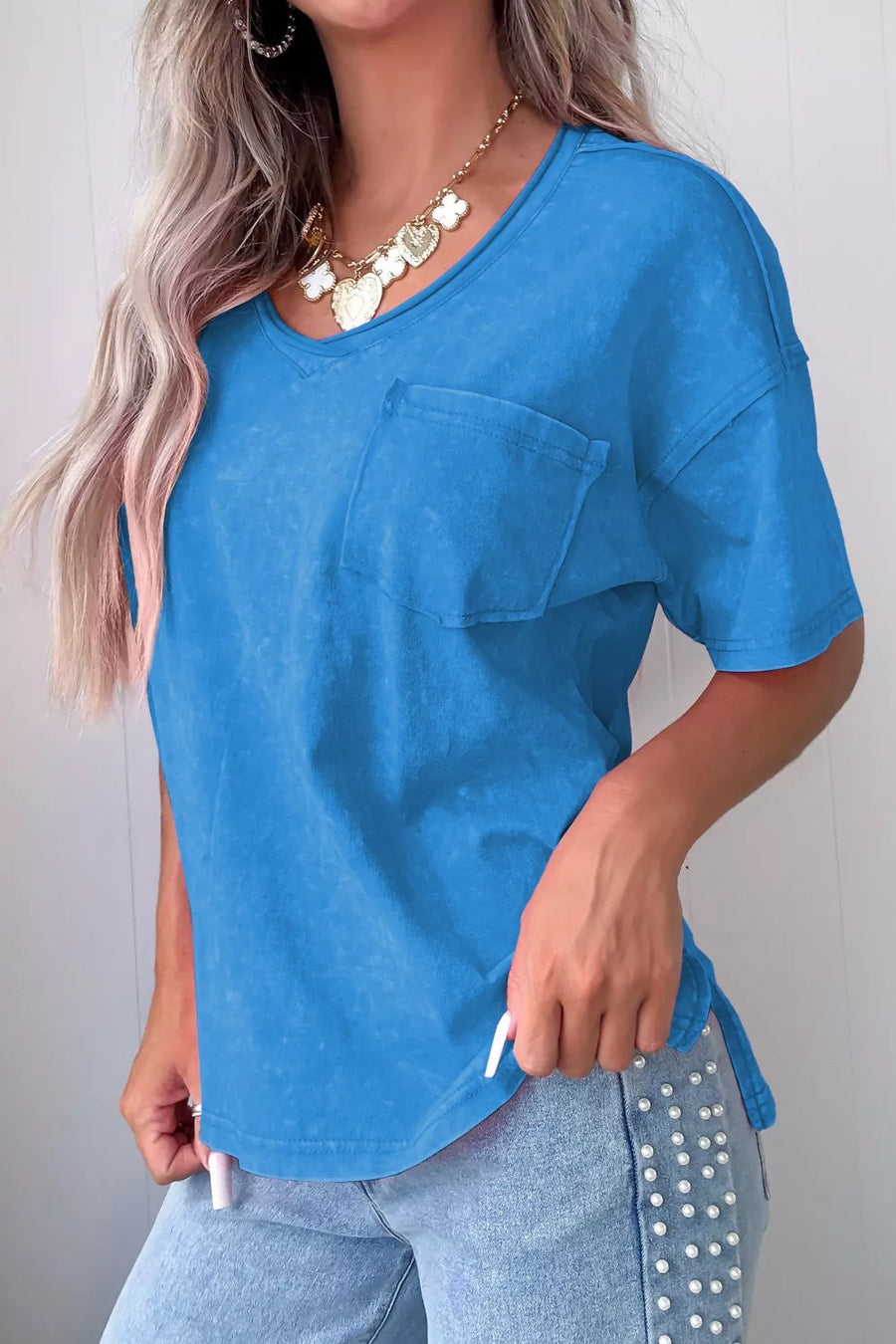 Blue cotton V-neck t-shirt with short sleeves and a chest pocket.