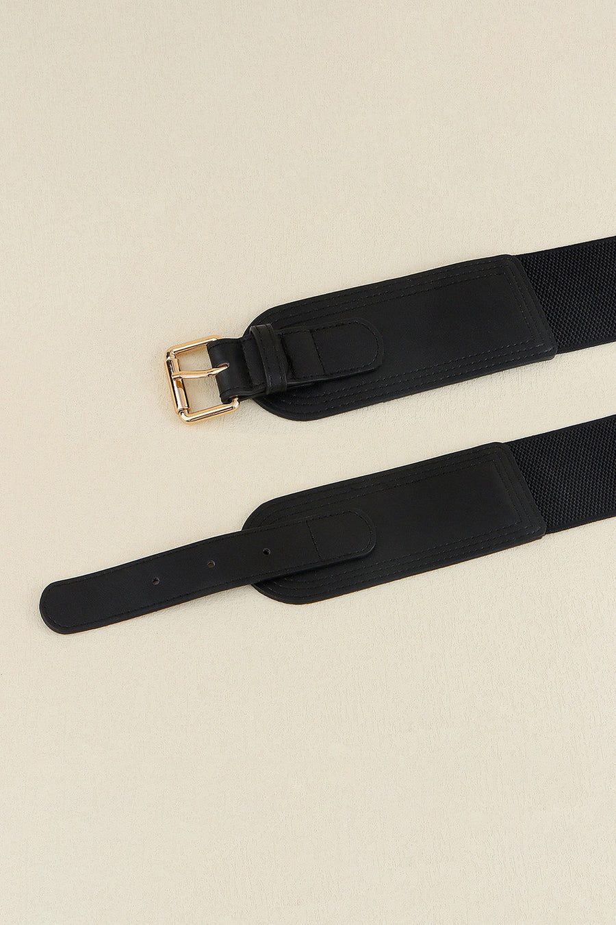 Black elasticated waist belt with gold buckle and faux leather details