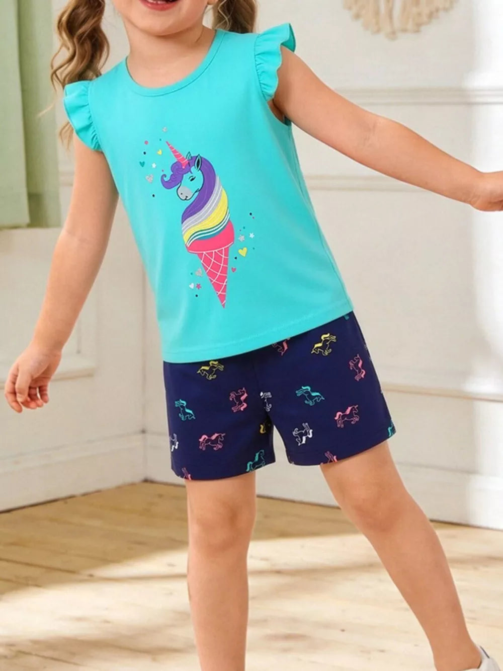 Aqua cotton toddler sleep set with unicorn ice cream graphic tee and unicorn print shorts.