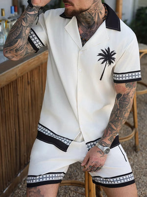 hawaiian shirt in black with tropical print and button-front