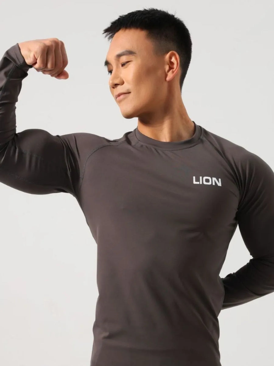 Dark gray performance raglan sleeve tee with white LION logo on chest.