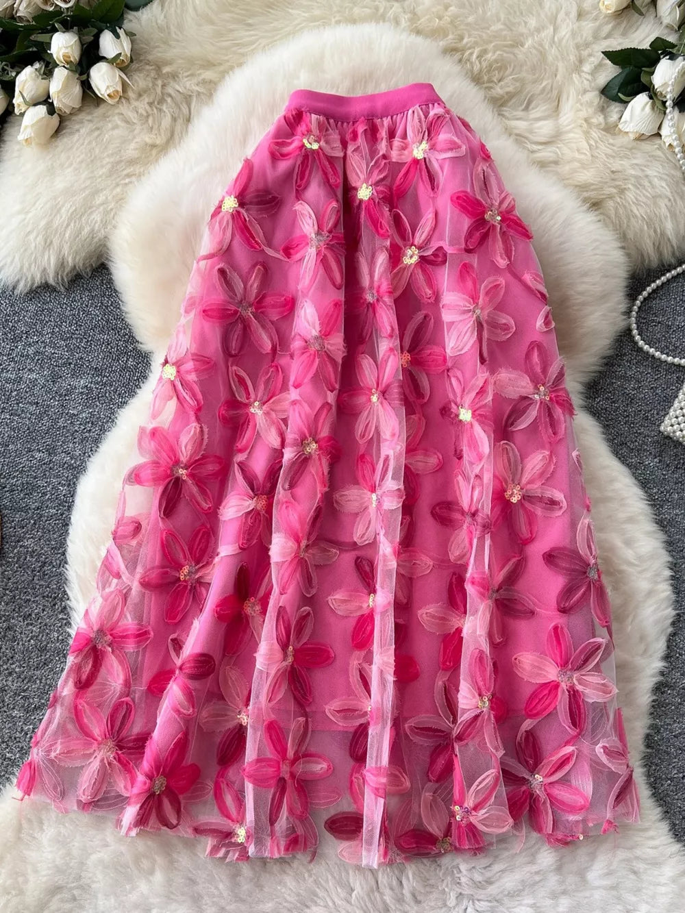 Pink floral embroidered layered midi skirt with sequin details.