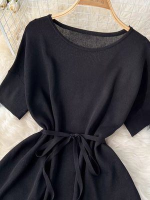 Black tied waist two-piece set with wide legs and short sleeves.