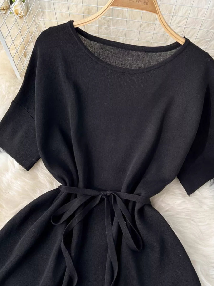 Black tied waist two-piece set with wide legs and short sleeves.