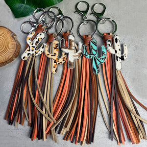 Cactus leather keychains with multi-color tassels in animal print, cowhide, and turquoise styles.