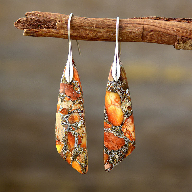 Tangerine and gold marbled stone dangle earrings with silver hooks.