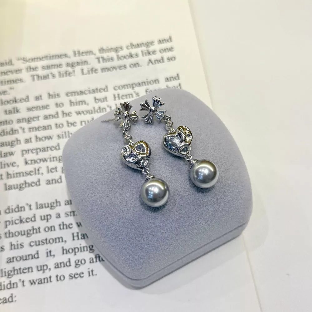 Sophisticated gray pearl heart drop earrings with cross accents.