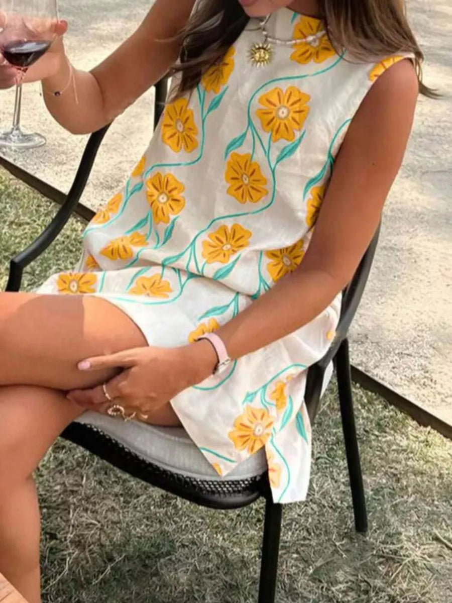 White sleeveless dress with yellow floral print