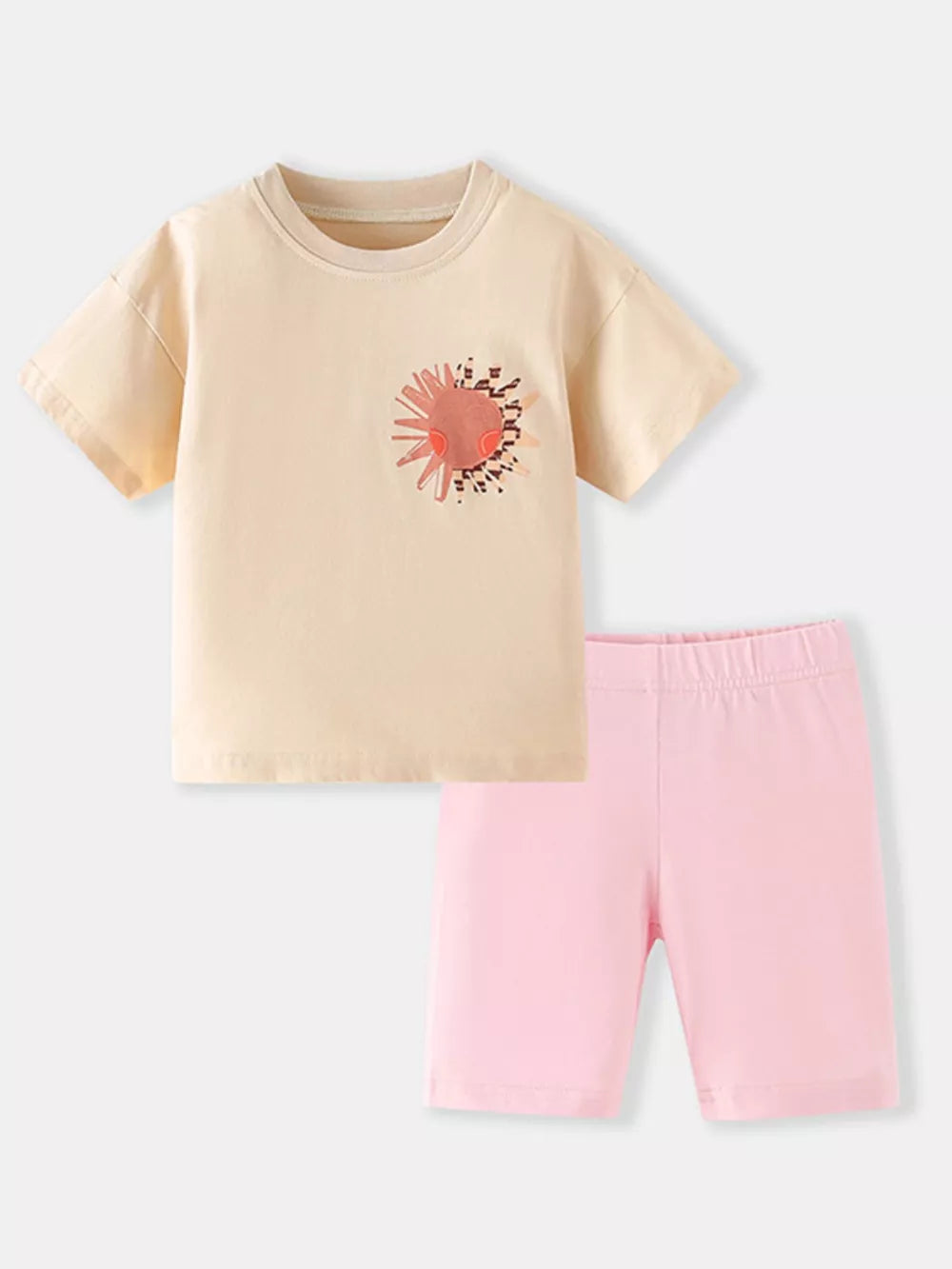 Toddler cotton set with peach sun graphic tee and pink bike shorts.