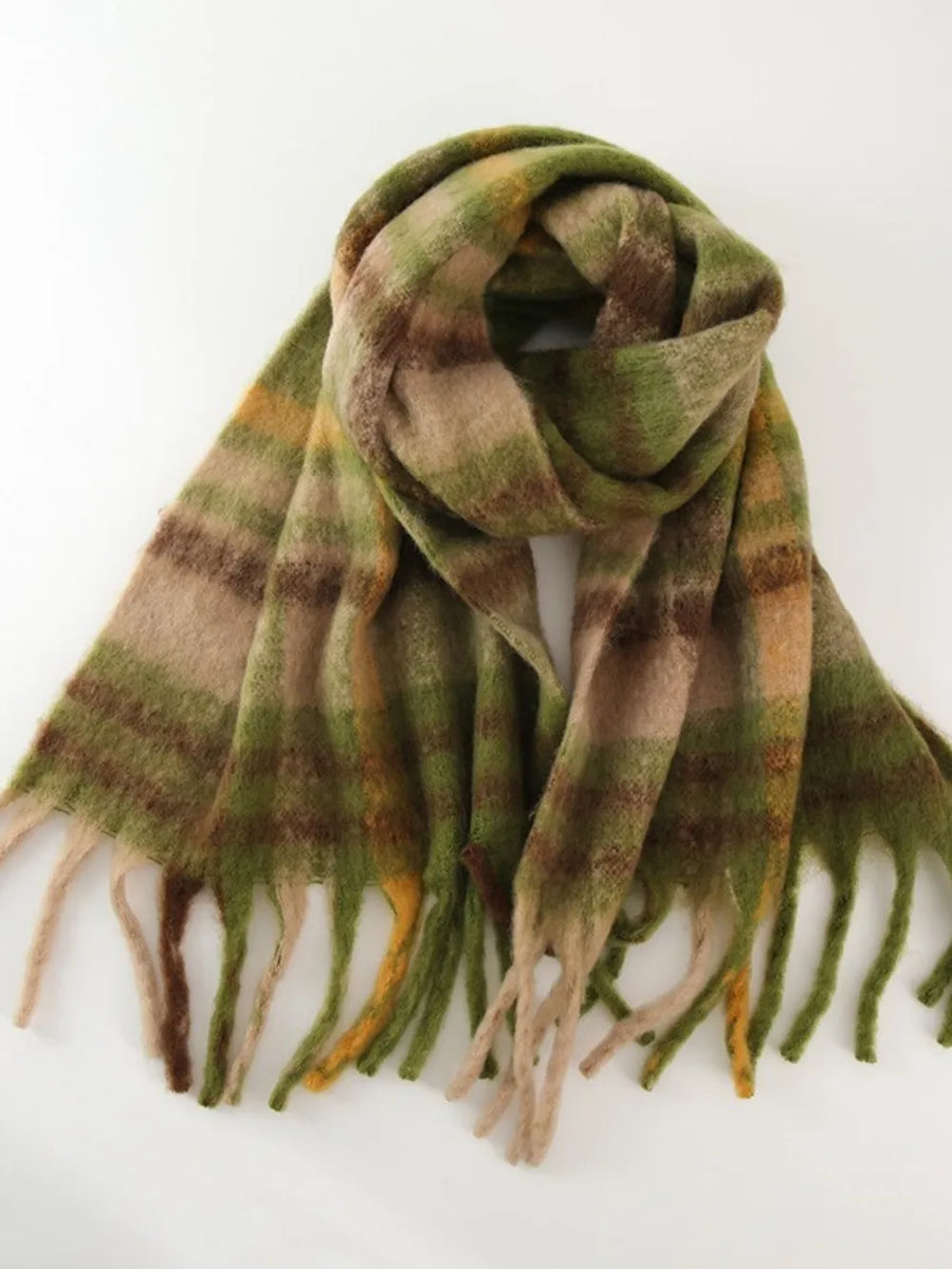 Textured plaid fringe wrap scarf in green, brown, and tan with fringed edges.