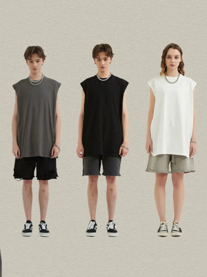 Sleeveless asymmetric panel tank top in black, white, or dark gray. Casual, bold style.