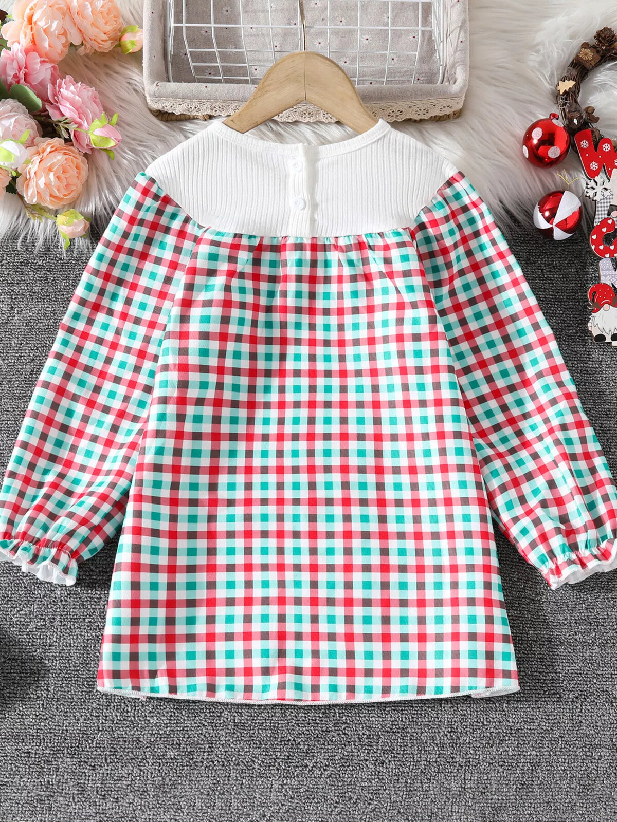 Baby girls' multicolor plaid dress with white ribbed top and button detail.