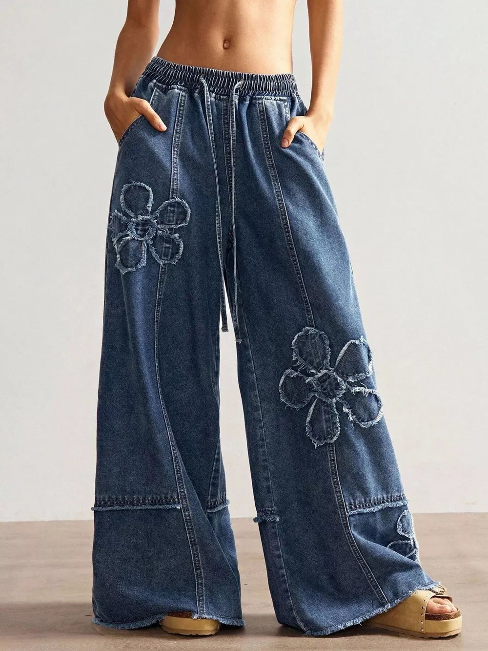 Black Gray wide-leg jeans featuring distressed and floral