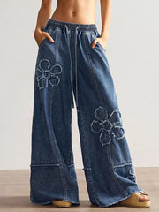 Black Gray wide-leg jeans featuring distressed and floral