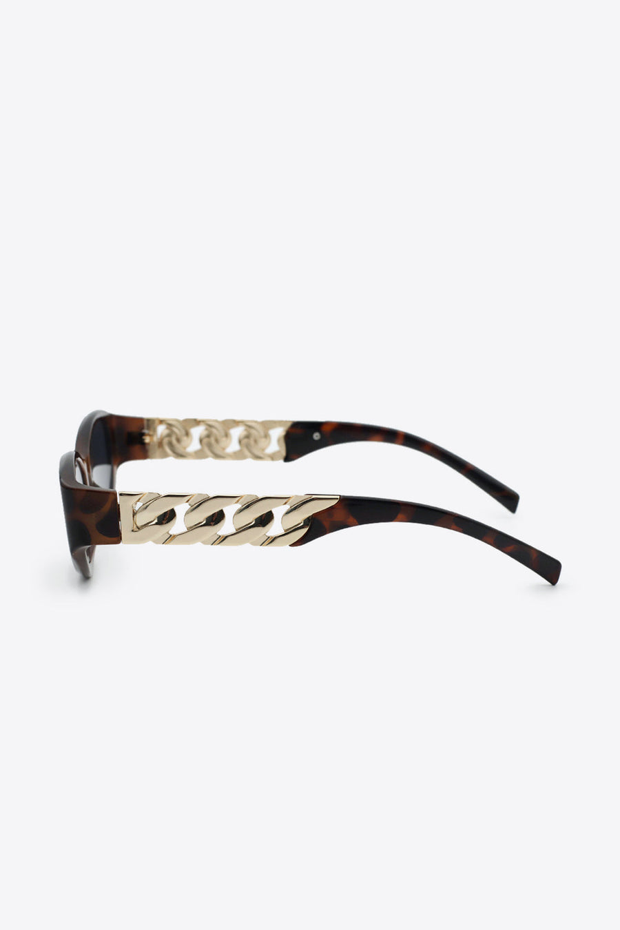 Tortoiseshell cat-eye sunglasses with gold chain detail on the temples.