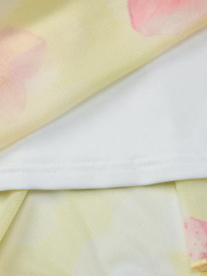 Yellow floral asymmetrical mini dress with ruffled hem detail