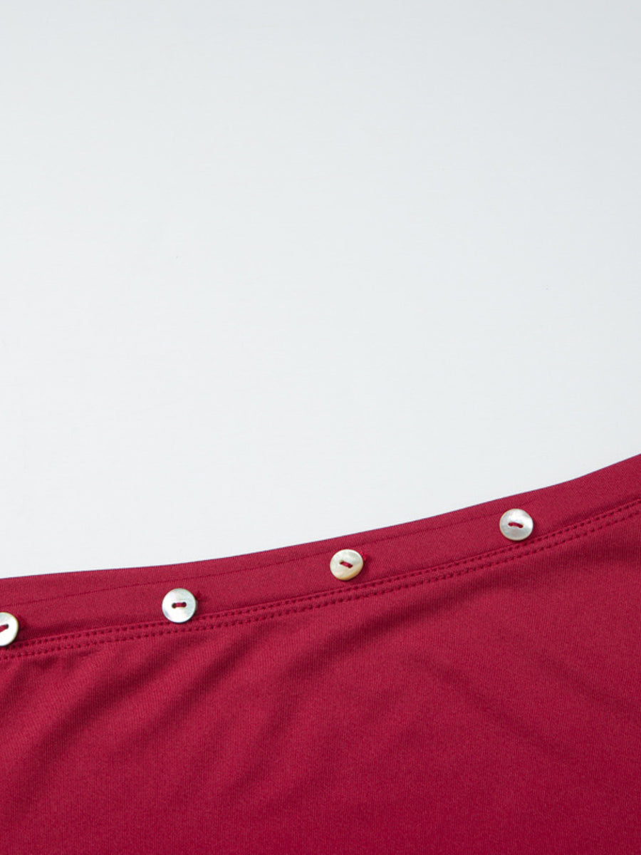 Red fitted one-shoulder t-shirt with pearl button detail