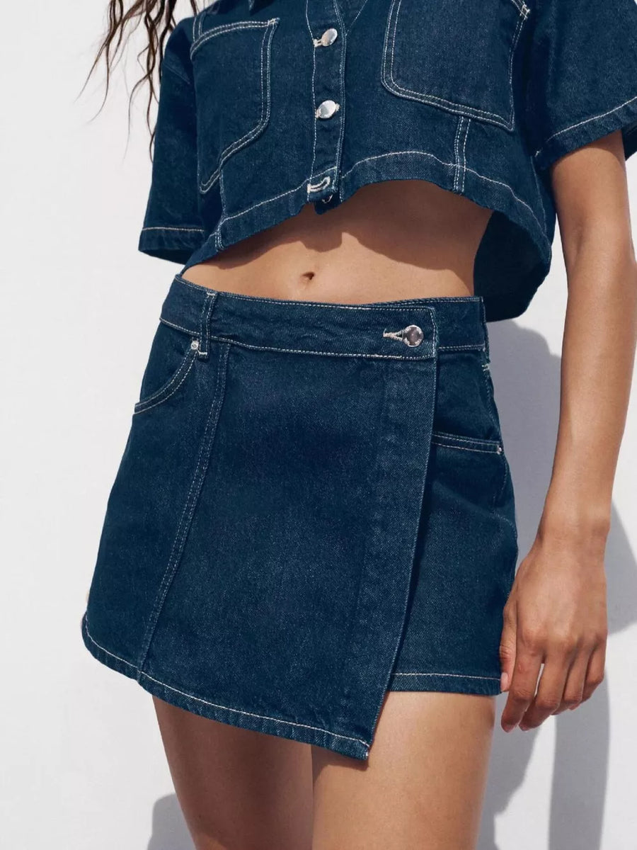 Dark blue cotton cropped button-up top and skort set with contrast stitching.