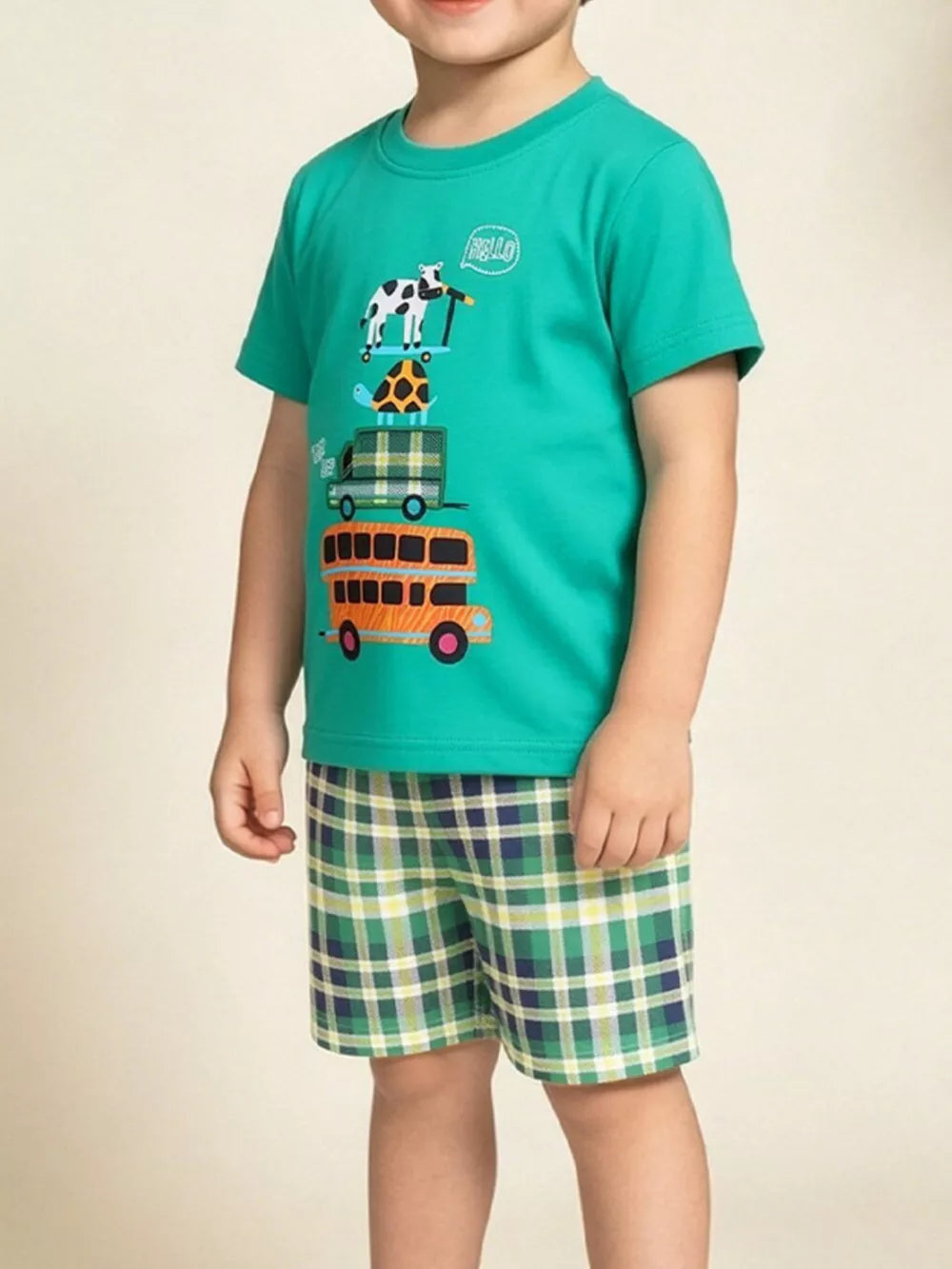 Toddler green cotton t-shirt with vehicle print and plaid shorts.