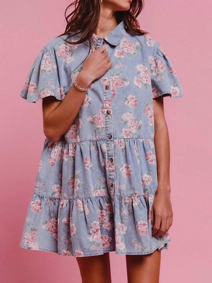 Light blue floral denim mini dress with ruffled tiers and short flutter sleeves.