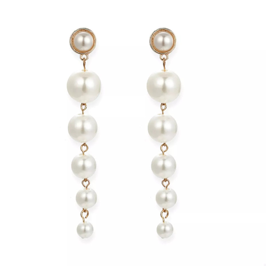 Gold cascading pearl drop earrings with multiple pearl sizes.