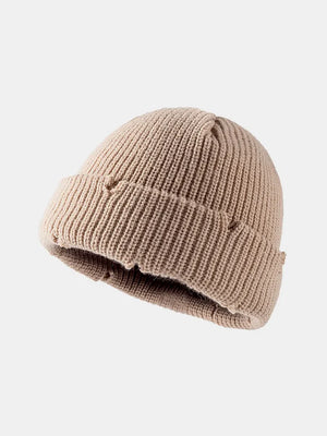Khaki ribbed knit beanie with distressed details and a cuffed brim.