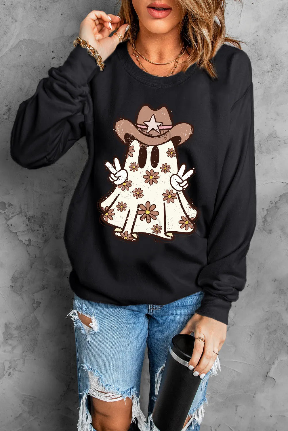 Black crewneck sweatshirt with cowboy ghost graphic and floral pattern.