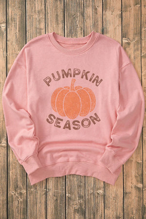 Blush pink crewneck sweatshirt with pumpkin and text graphic